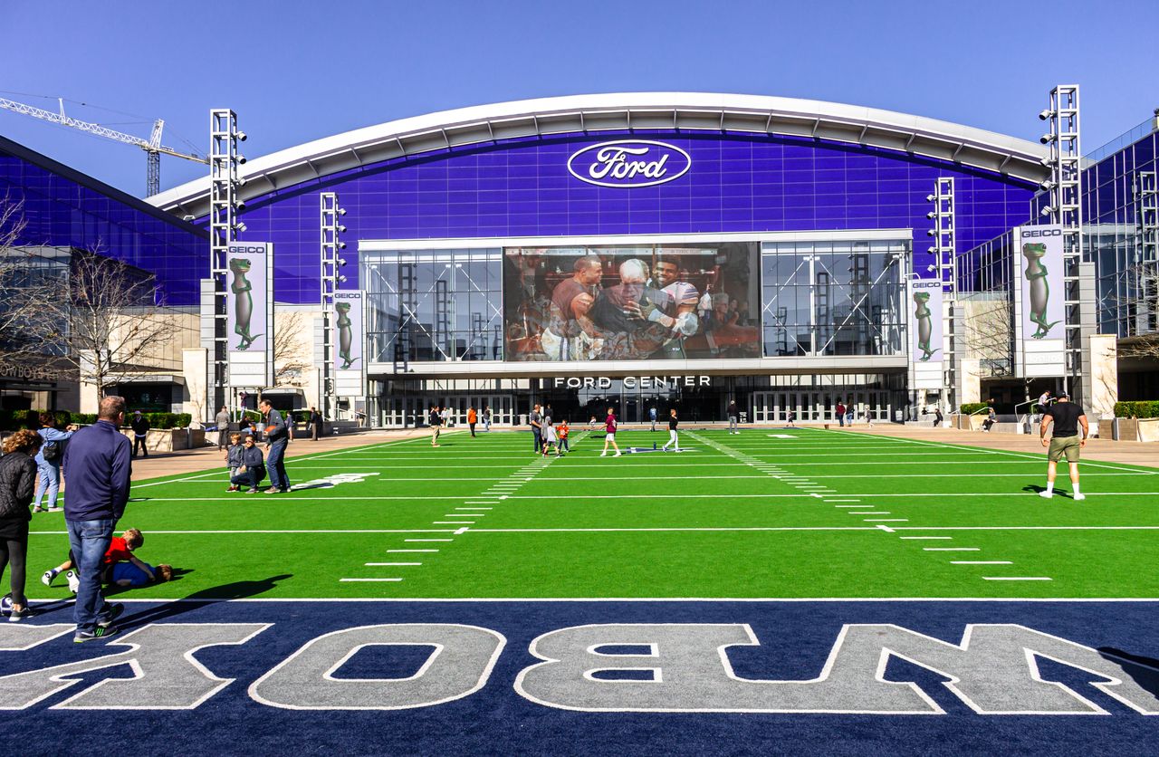 gallery-4 A lively scene at the Ford Center sports venue with people enjoying the outdoors.